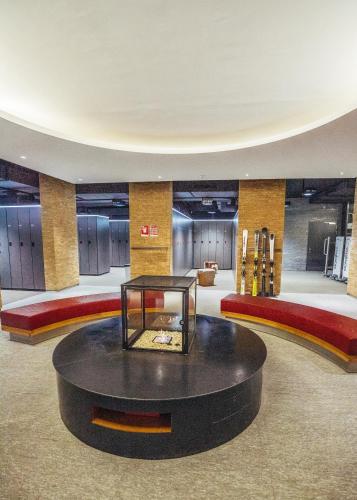 a large room with a table in the middle of it at Suvretta House in St. Moritz