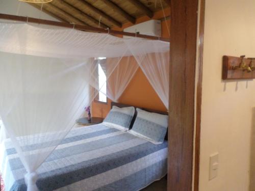 Katil atau katil-katil dalam bilik di Recanto das Flores
