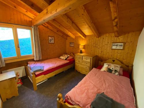 A bed or beds in a room at K2 Chalet