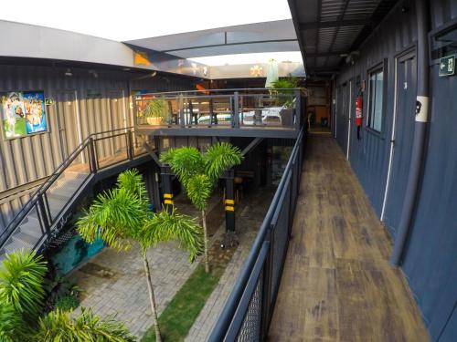 an empty hallway of a building with palm trees at Hotel Bonito Motobox - HOTEL CONTAINER in Bonito