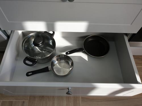 two pots and pans sitting on top of a stove at Best Apartment Truskavets in Truskavets