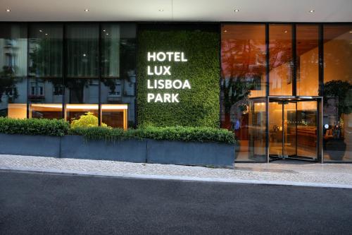 a hotel lux lesoya park sign on the side of a building at Lux Lisboa Park in Lisbon