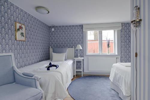 Katil atau katil-katil dalam bilik di Hilma Winblads Bed & Breakfast