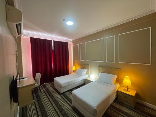 Ліжко або ліжка в номері Hotel UiTM Shah Alam