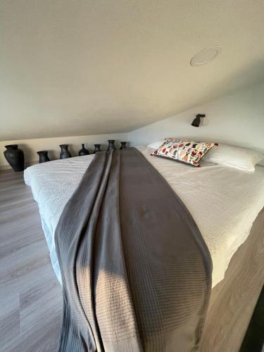 a large bed in a room with at Studio Solare in Portorož