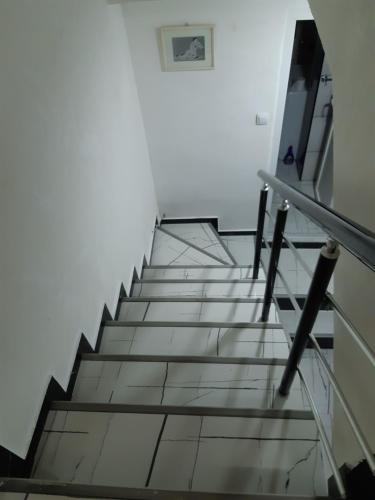 a stairway in a building with a stair case at Djakuzi Viktorija in Belgrade