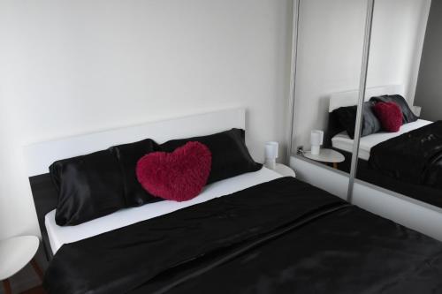Postel nebo postele na pokoji v ubytování Api Apartment