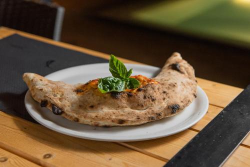 a piece of food on a plate on a table at Marmari Bay Hotel in Marmarion