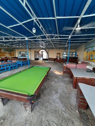 a large room with a pool table in it at Al Baeirat Hotel in Luxor