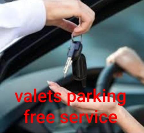 a person holding a pair of car keys at Hotel LAHLOU riad Cafeteria in Oujda