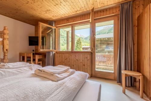 Postel nebo postele na pokoji v ubytování Hotel Walser