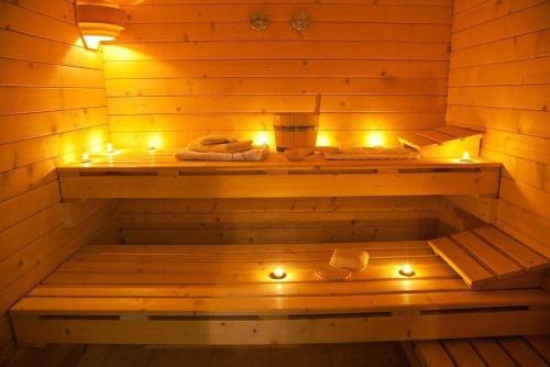 a sauna with lights on the inside of it at Complex Turistic Dávid in Boghiş