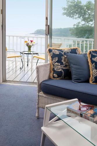 a living room with a couch and a glass table at Dockside Guest Quarters in York