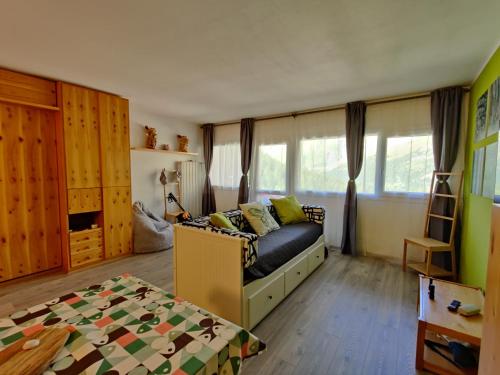 Ένα ή περισσότερα κρεβάτια σε δωμάτιο στο Condominio I Dadi - Appartamento a Cielo Alto