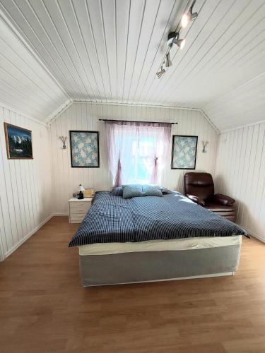a bedroom with a large bed in a room at Egil's Vacation House in Lillehammer