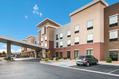a car parked in a parking lot in front of a hotel at Sleep Inn & Suites Hurricane Zion Park Area in Hurricane