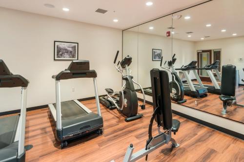 a gym with tread machines and a mirror at Sleep Inn & Suites Hurricane Zion Park Area in Hurricane