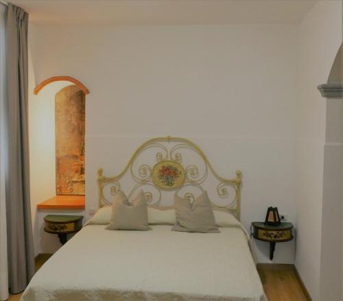 Ένα ή περισσότερα κρεβάτια σε δωμάτιο στο Appartamento Antico Pozzo