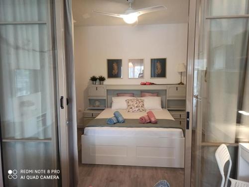 Posteľ alebo postele v izbe v ubytovaní Cozy Suite Siviri
