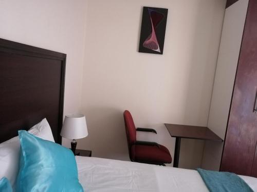 Postel nebo postele na pokoji v ubytování LALA POA GUEST HOUSE