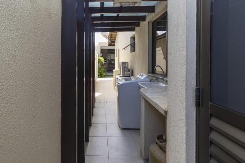 a view of a kitchen with a sink and a counter at Casa belaju in Aracaju