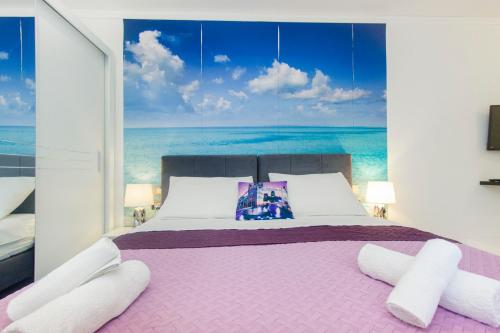 Łóżko lub łóżka w pokoju w obiekcie Apartment Seaside, free parking