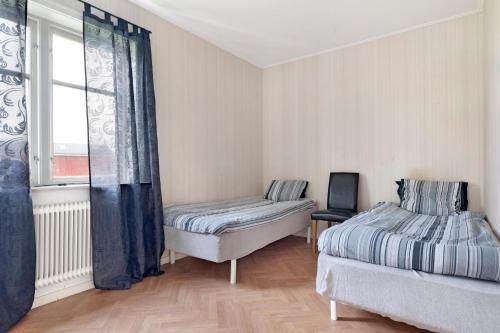 Un ou plusieurs lits dans un hébergement de l'établissement Charming old 3BR house w/ open location near Piteå and Markbygden