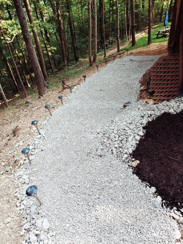 a group of birds walking down a gravel road at Trailseeker Cabin w King Bed Hot Tub at Red River Gorge Natural Bridge in Stanton