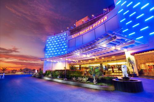 a hotel is lit up at night at Lion Hotel & Plaza in Manado