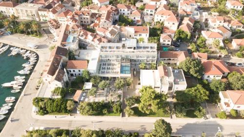 an aerial view of a city with white buildings at Hotel Osam - Adults Only in Supetar