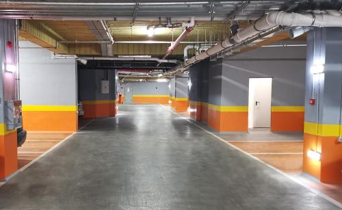 an empty room with orange yellow and blue walls at ibis Bucharest Politehnica in Bucharest