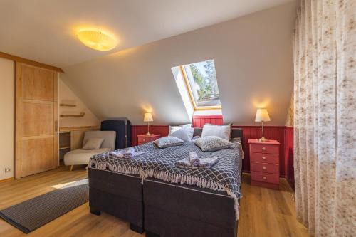 a bedroom with a large bed and a window at Nuutri Villa in Kärdla