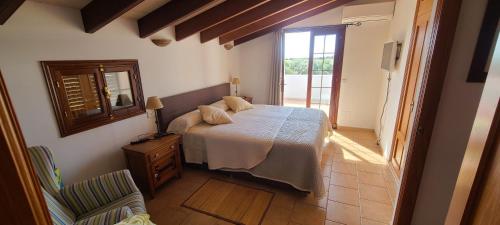 A bed or beds in a room at Son Set Villa