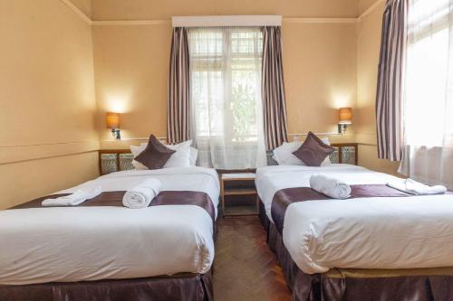 Postel nebo postele na pokoji v ubytování Impala Hotel Parklands