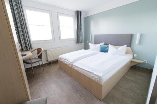 Postel nebo postele na pokoji v ubytování Rosen-Hotel