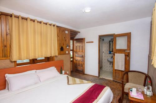 Postel nebo postele na pokoji v ubytování Everest Manla Resort