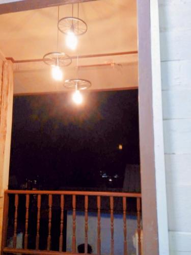 a room with a balcony with a view of the water at ฮักเคียงโขง HUG Khieng Khong Nongkhai Hostel in Nong Khai