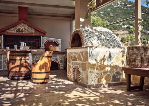 a house with a dog inside of it at Lithakia Balcony Villa - Private Pool, Large Groups & Sea View, by ZanteWize in Lithakia