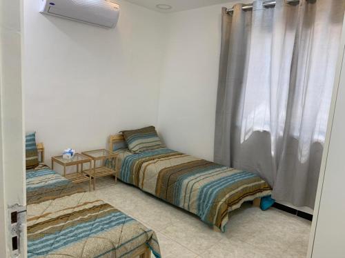 En eller flere senge i et værelse på Gedara Guesthouse: enjoy unforgettable scenes