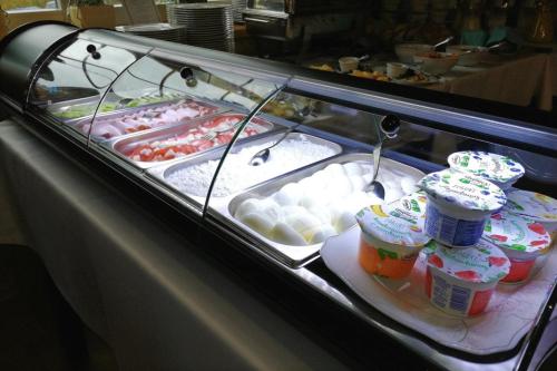 a display case with many different types of food at Dwór Maria Antonina in Strzyżów