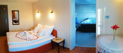 a hotel room with a bed with a balloon on it at Dwór Maria Antonina in Strzyżów