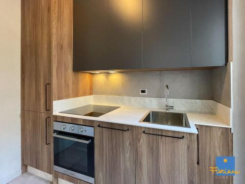 a kitchen with a sink and a stove at Florian Home in Pescara