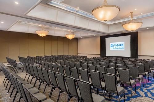 a lecture hall with chairs and a projection screen at Wyndham San Diego Bayside in San Diego