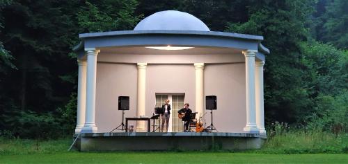 two people standing on a stage in a dome at Dwór Maria Antonina in Strzyżów