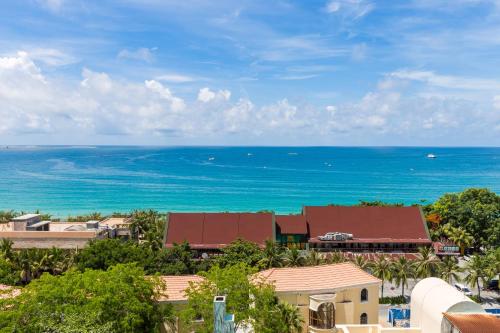 a view of the ocean from a resort at Sanya Sun Seaview Apartment in Sanya