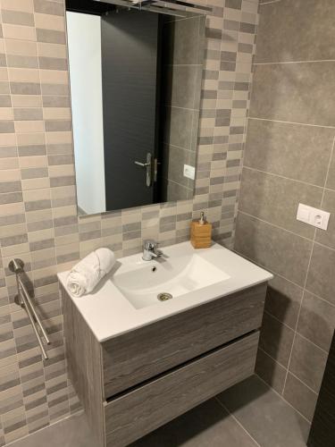 a bathroom with a sink and a mirror at Villa Rosaura in Las Palmas de Gran Canaria