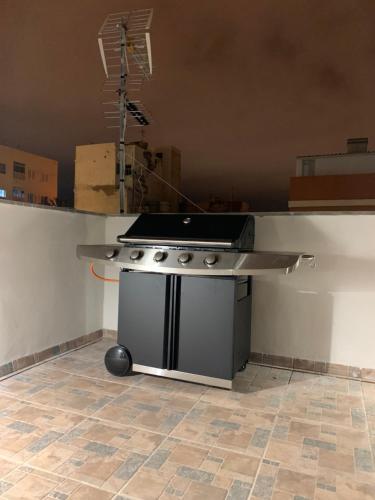 a kitchen with a stove and a counter top at Villa Rosaura in Las Palmas de Gran Canaria