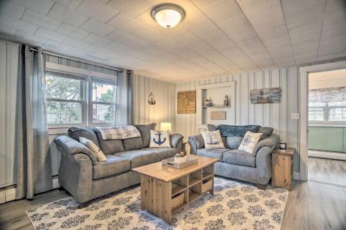 a living room with two couches and a coffee table at Buttermilk Cottage in Cape Cod Steps to Beach in Wareham