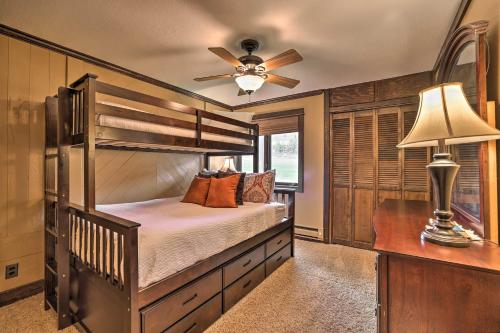 a bedroom with a bunk bed and a ceiling fan at Brian Head Condo with Patio and Community Amenities! in Brian Head