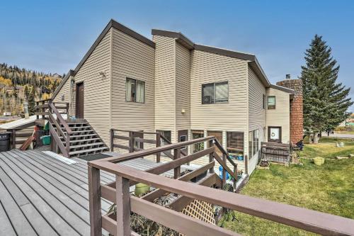 a home with a large deck with a house at Brian Head Condo with Patio and Community Amenities! in Brian Head